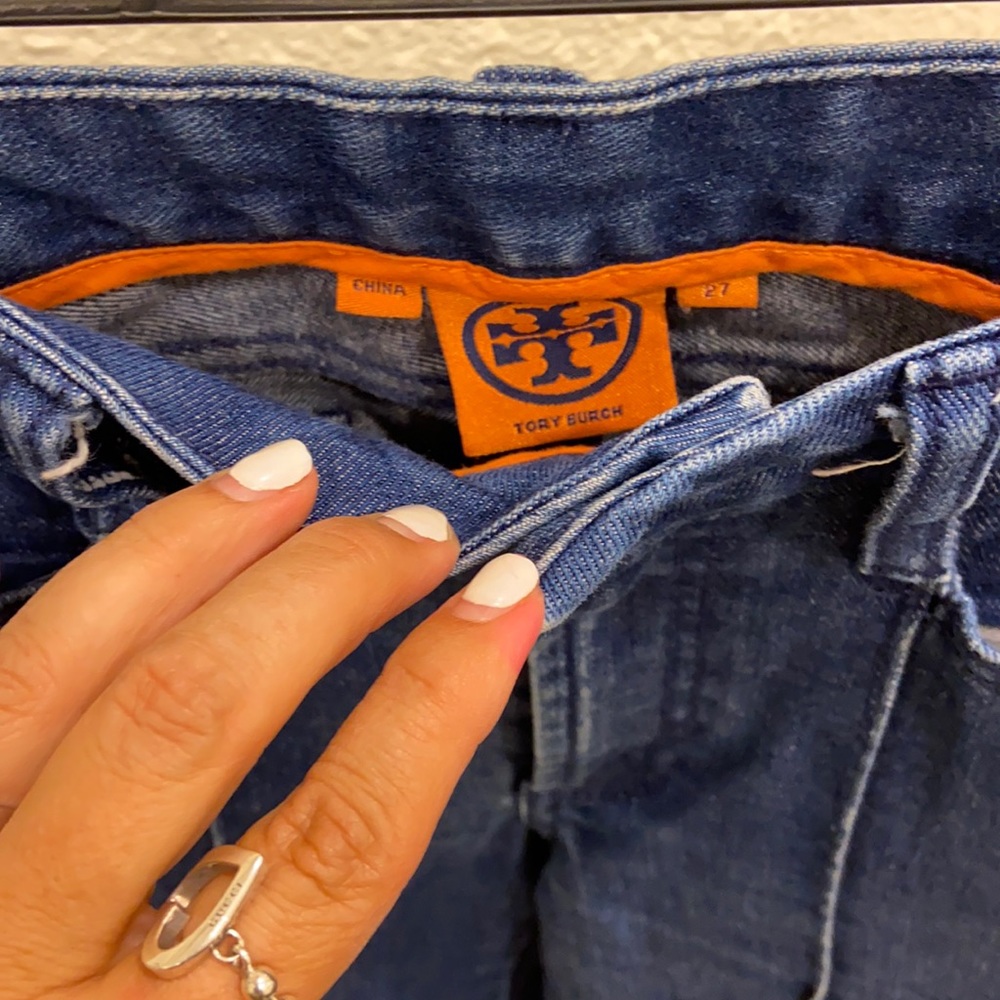 Tory Burch size 27 jeans small flare at bottom no rips or tears